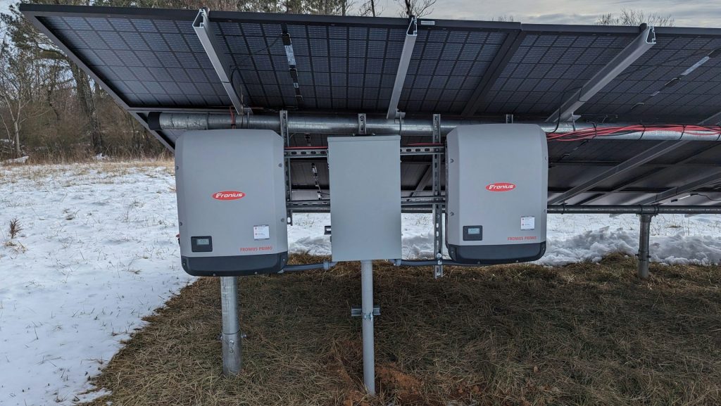 a solar panel attached to a pole in the snow